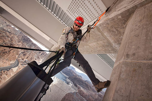 Bridge inspector hanging 840 feet above the Colorado River.